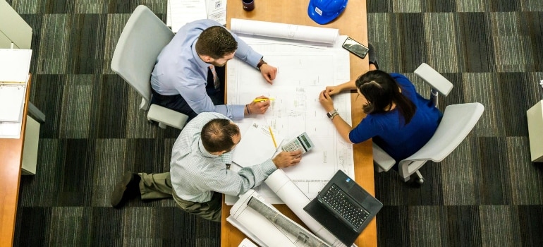 People in the office, discussing. 