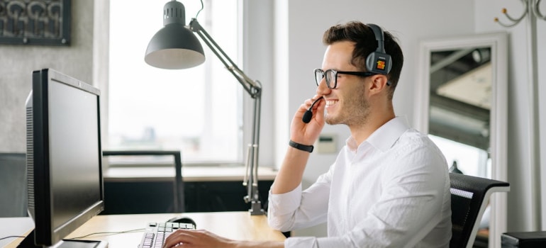 a person holding a microphone on the headset