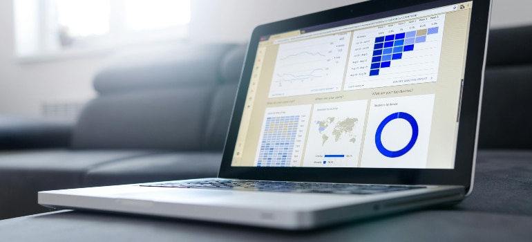 Laptop displaying analytics dashboards with charts and graphs, showcasing data analysis tools that explain why localized digital ads work.