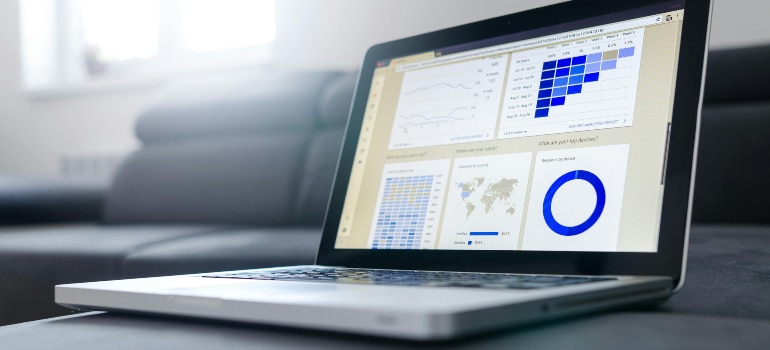 Laptop screen displaying SEO analytics charts and graphs.