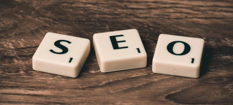 scrabble tiles spelling out seo