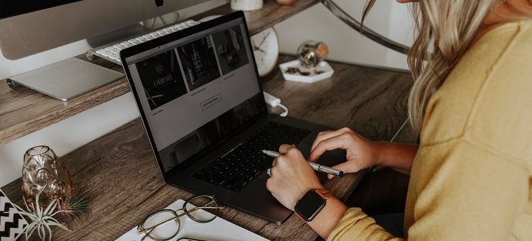Woman typing on her laptop.