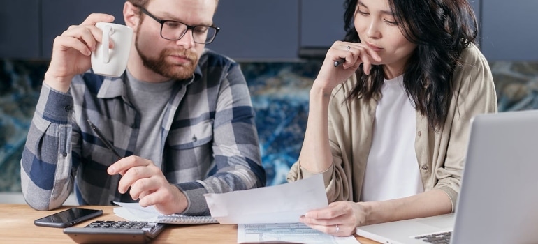 a man and a women looking at some papers