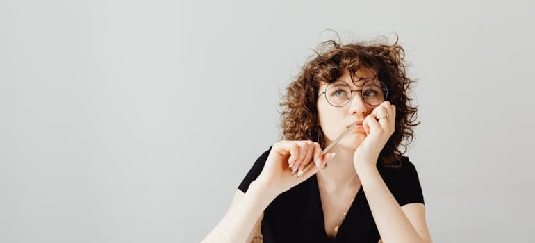 A person thinking about the results of their marketing agency evaluation for moving companies