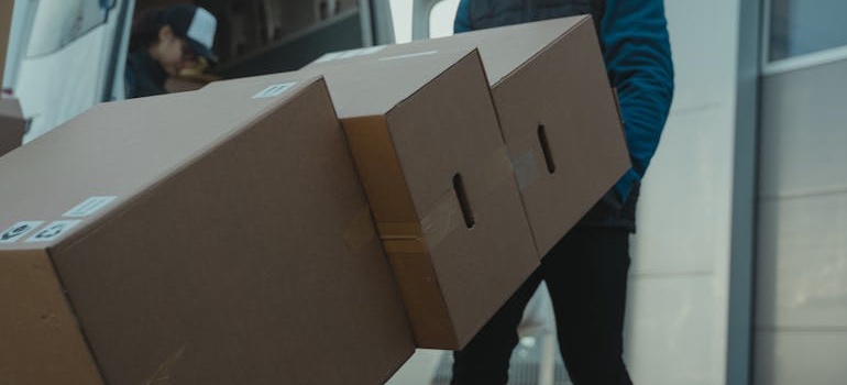 A person moving boxes