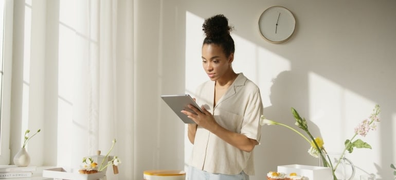 a woman checking something on her tablet 