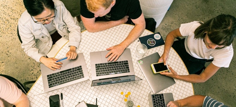 a team of people working on 5-Minute marketing fixes that can bring more jobs 