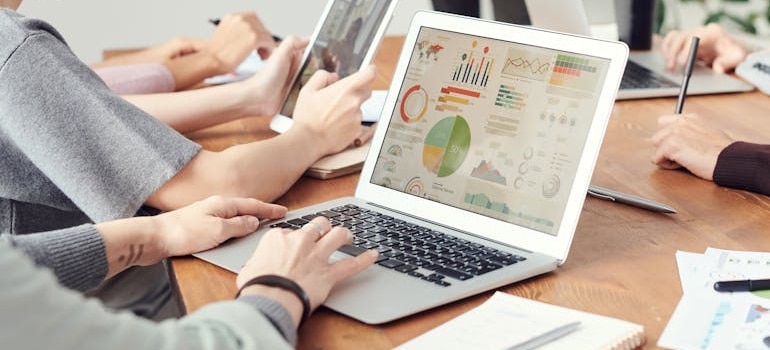 A person assessing the financial health of their company after discoving essential financial planning tips for expanding moving services