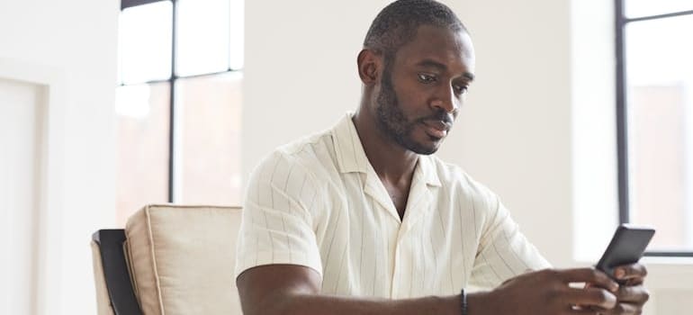 A person reading a follow-up email from a mover, showing how a 3-star moving company stole your customers with persistence