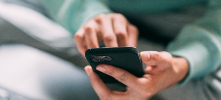 Person using phone to search, showing how AI changes search behavior