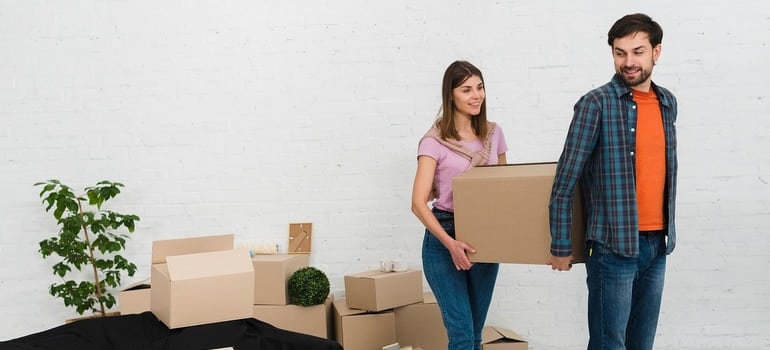 Urban couple moving a few boxes for a micro-move