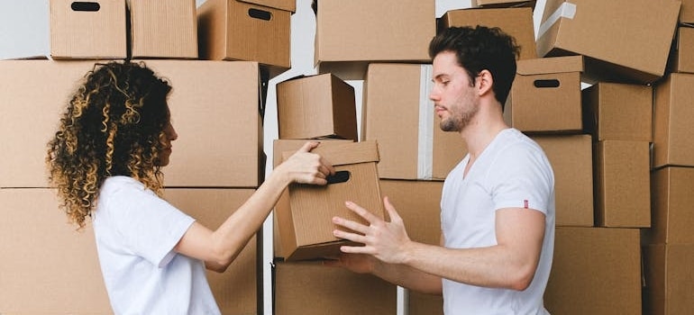 A couple packing and preparing for a move